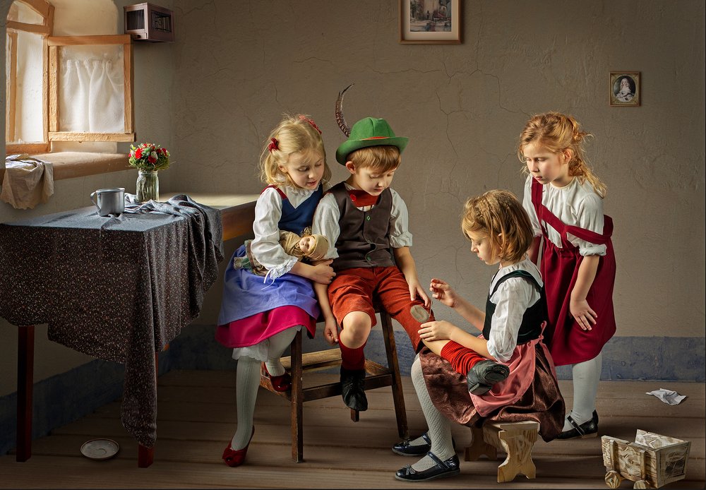 Young girl mending pants