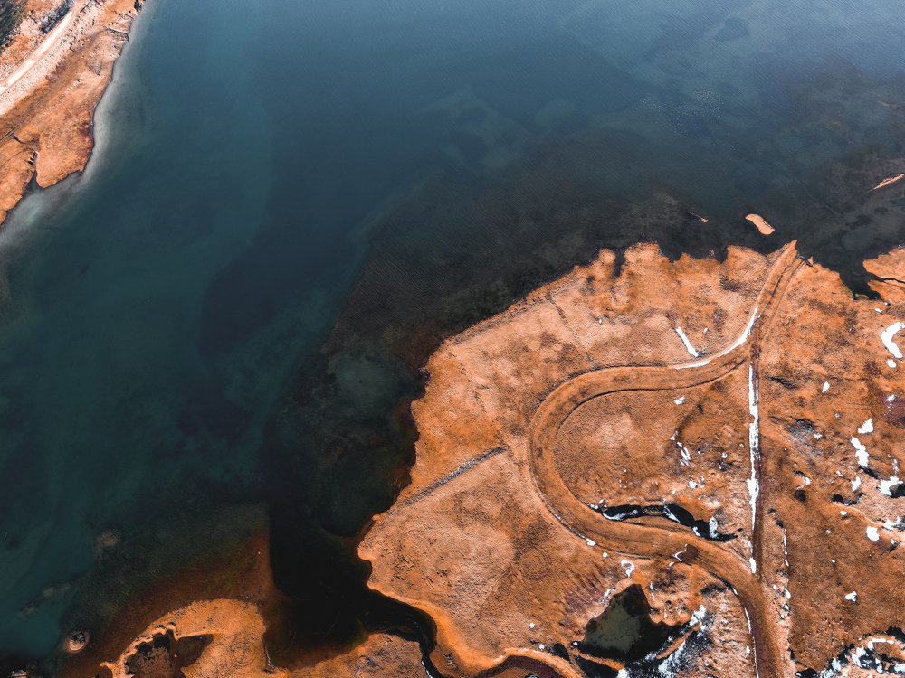 Different perspective of road in lake