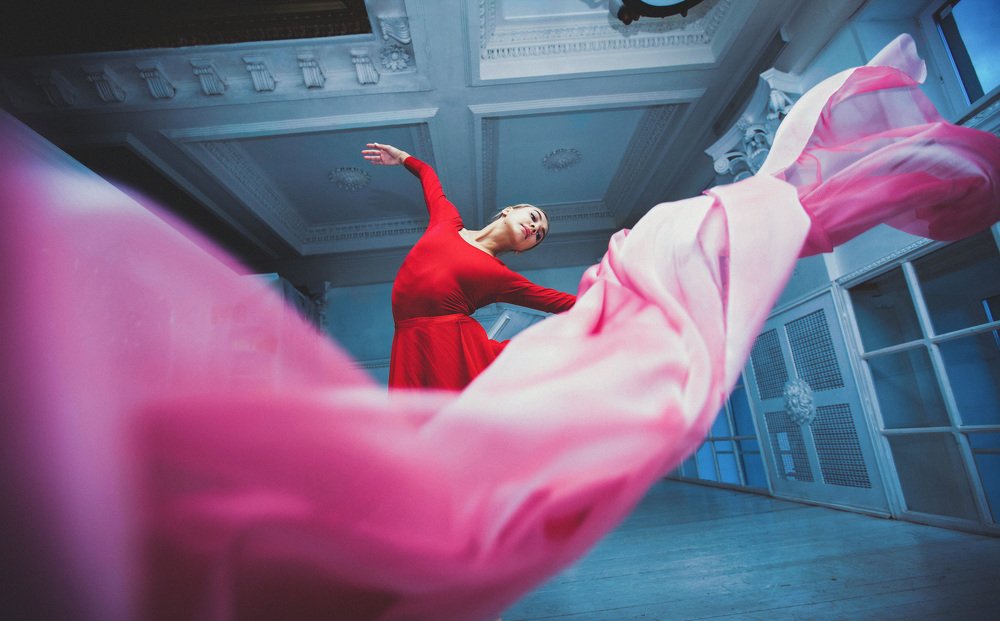 Ballerina dancing with fabric