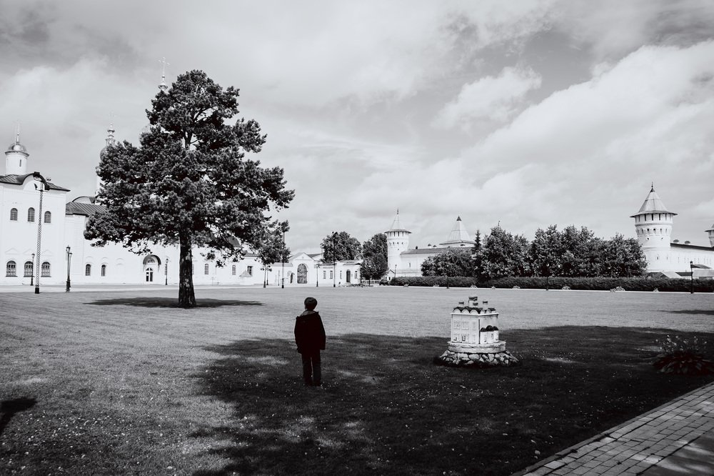a boy in the shadows.