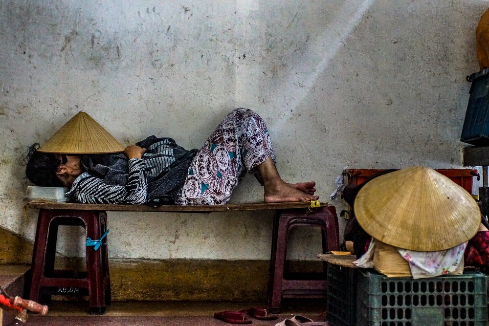 Sleeping market woman in Vietnam