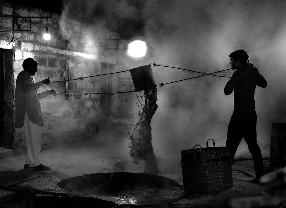 Two man are working in factory