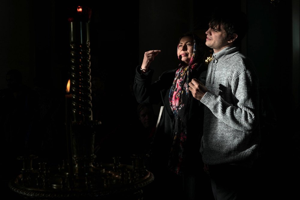 Special mother and son praying in the church