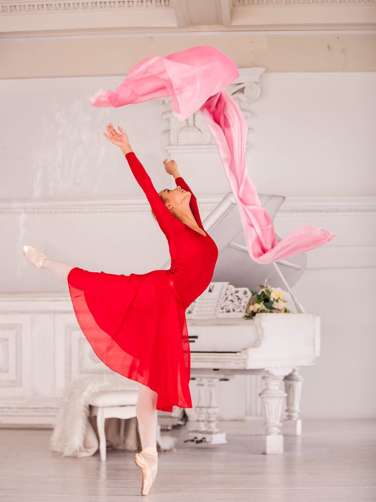 Ballerina dancing with fabric