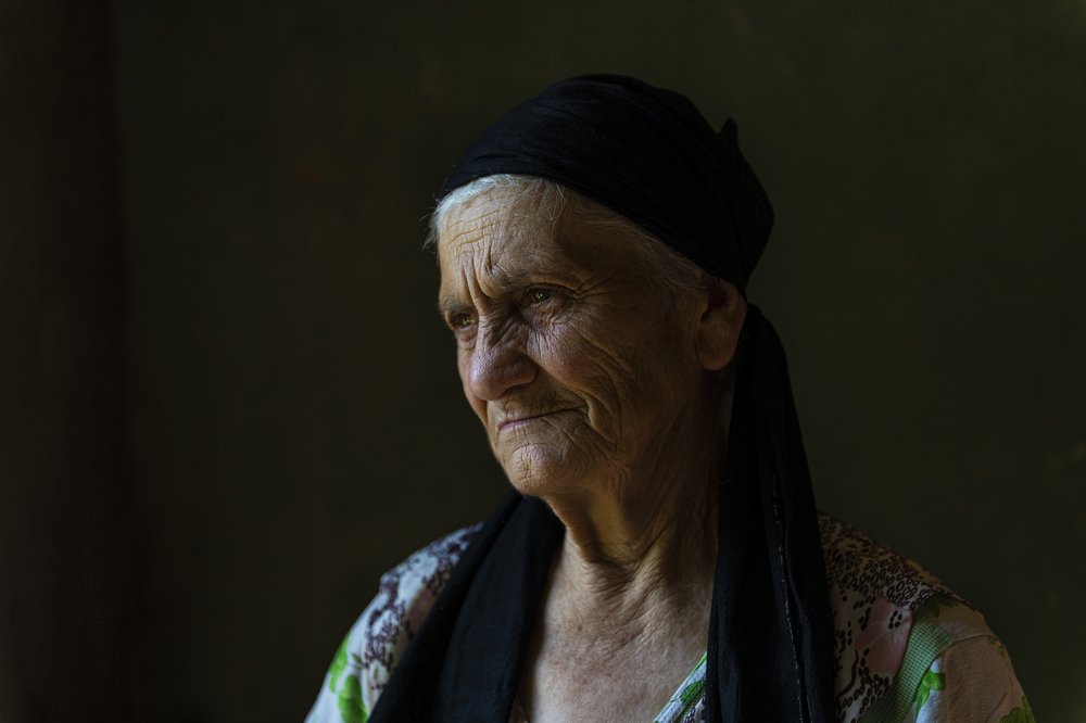 Old female looking to th window