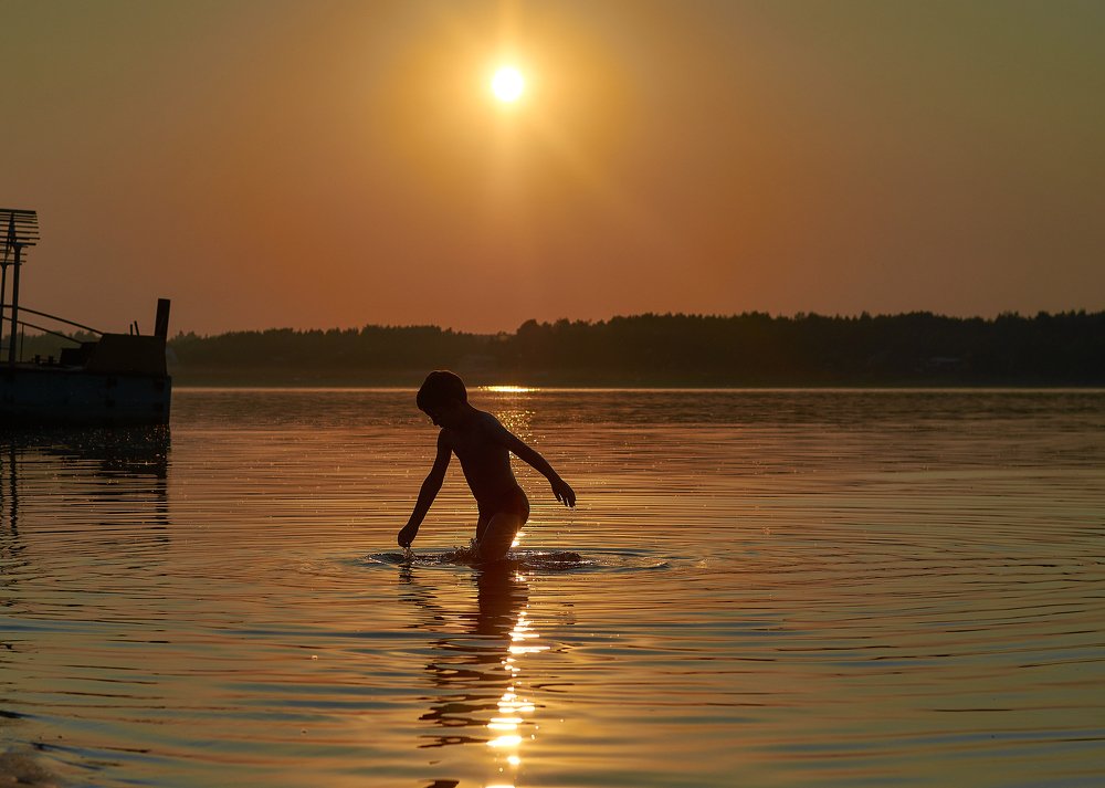 swimming at sunset