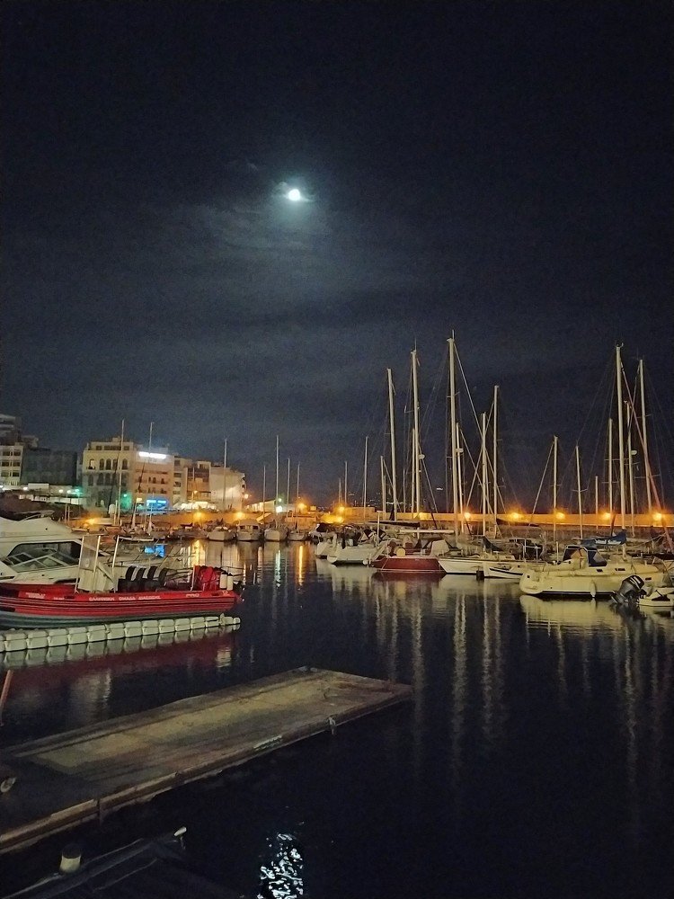Marina port of Heraklion at night with moon