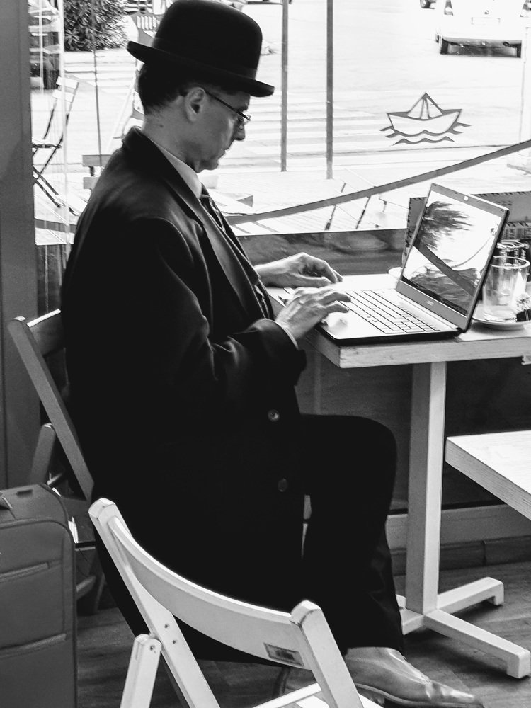 The man working with the bowler hat