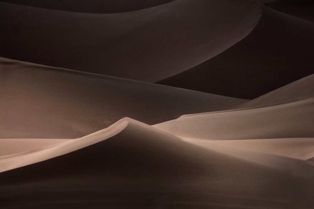 Shadow behind the dunes