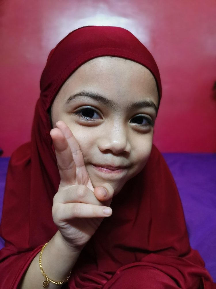 Child in Telekung after Solat
