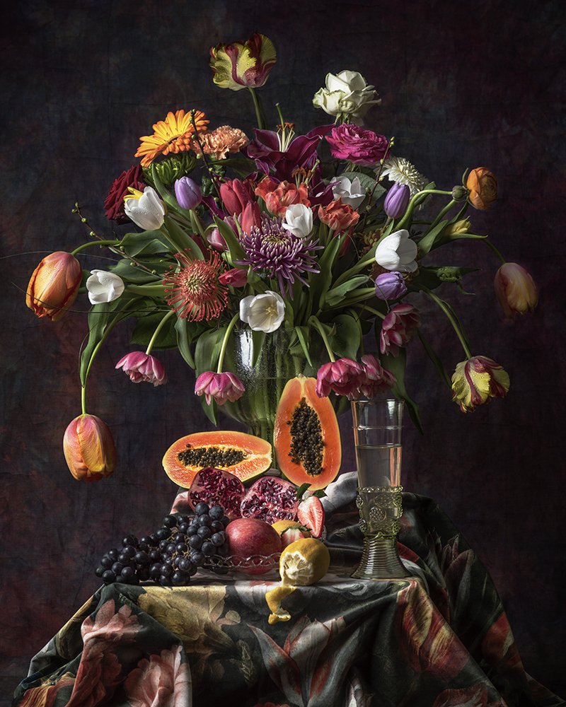 Flower stilllife with tulips and papaya