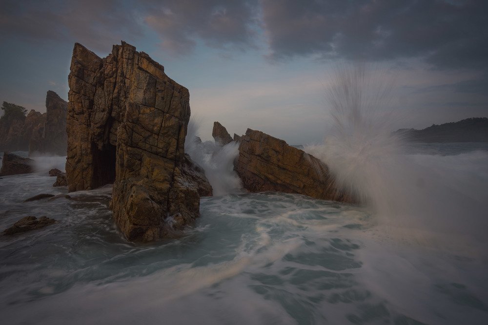Splashing wave over the solid Rocks.