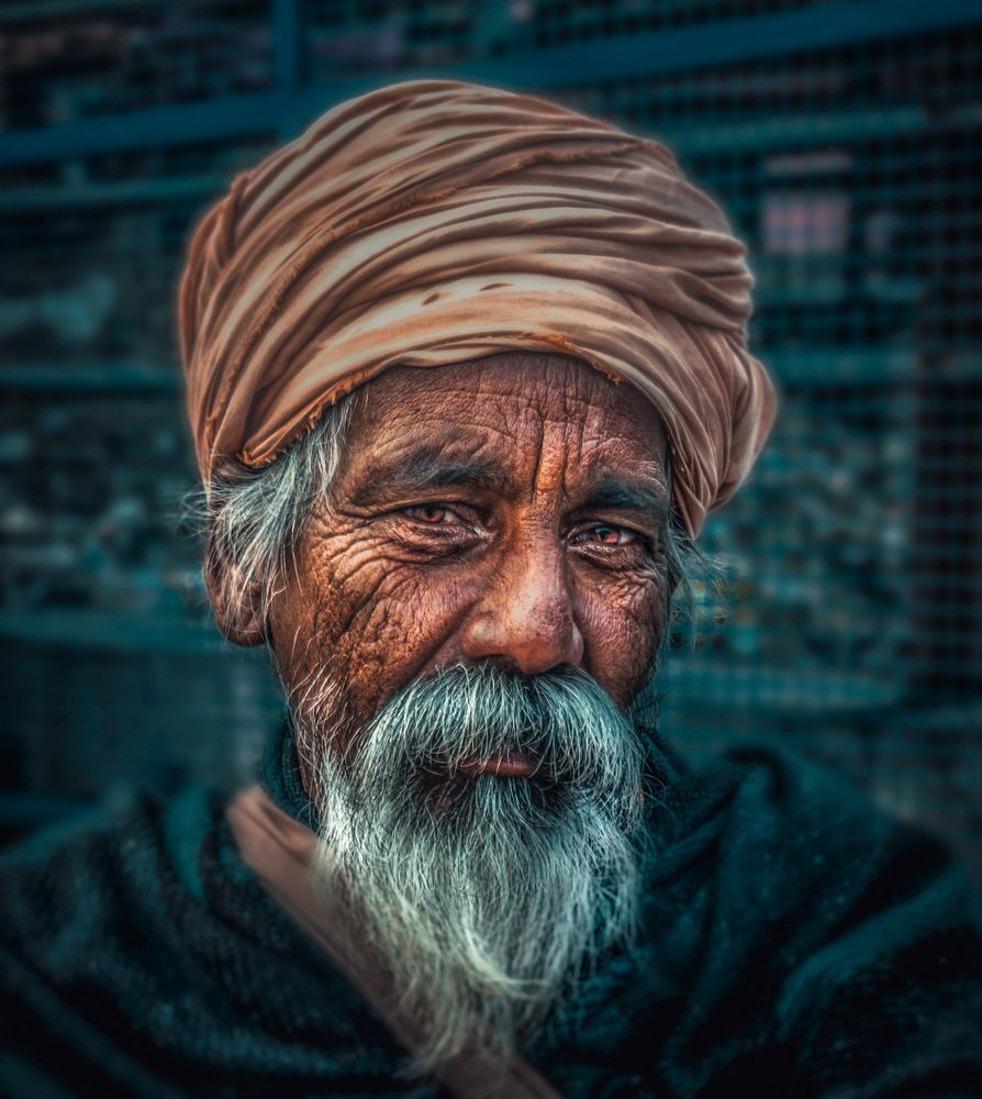 Old Indian Man on the bank of river Ganges.