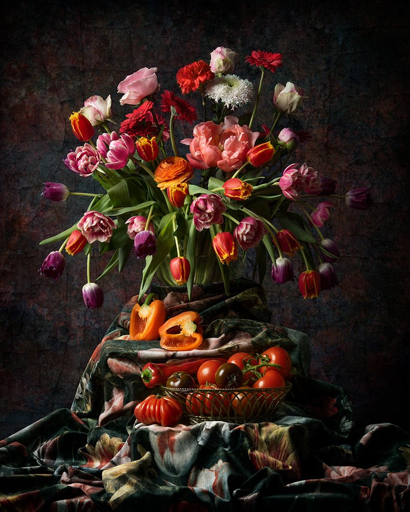 Flower stilllife with tulips and tomatoes