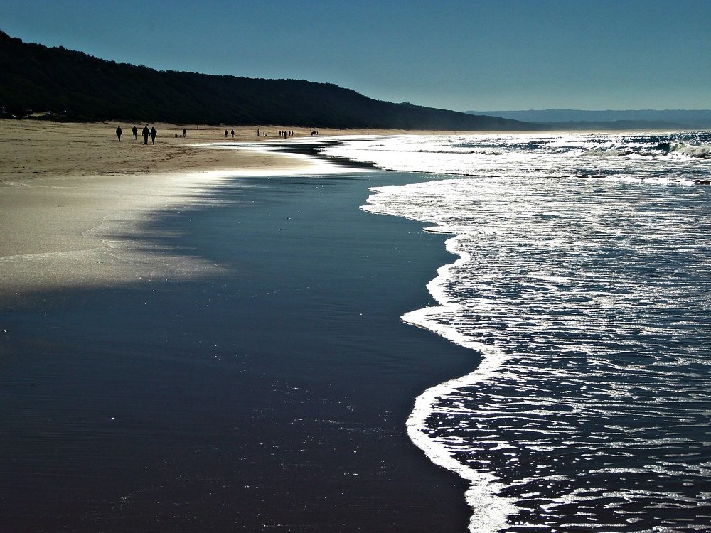 The sea curls up in the sand ...