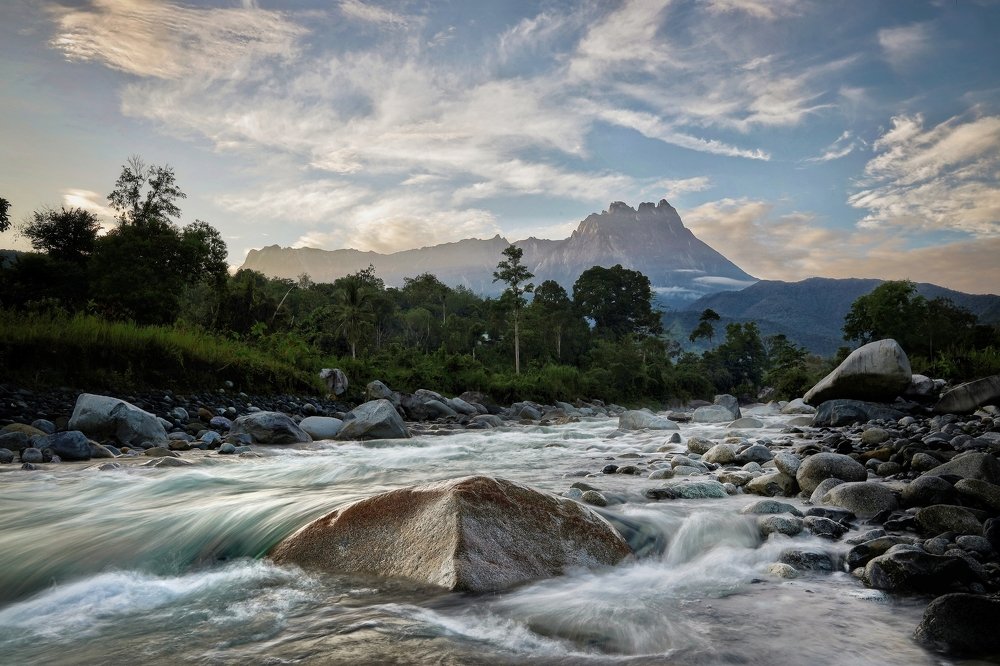 Melangkap river with view of Mount Kinabalu