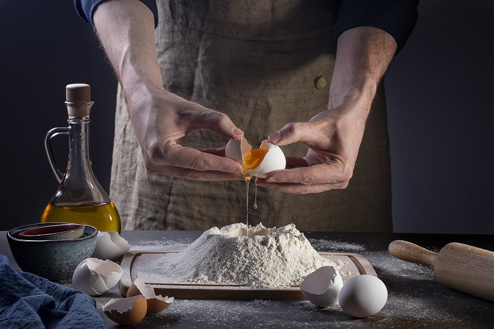Preparing egg pasta.