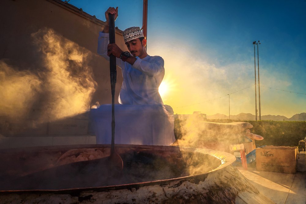 Chef stirring the gigantic pot of halwa