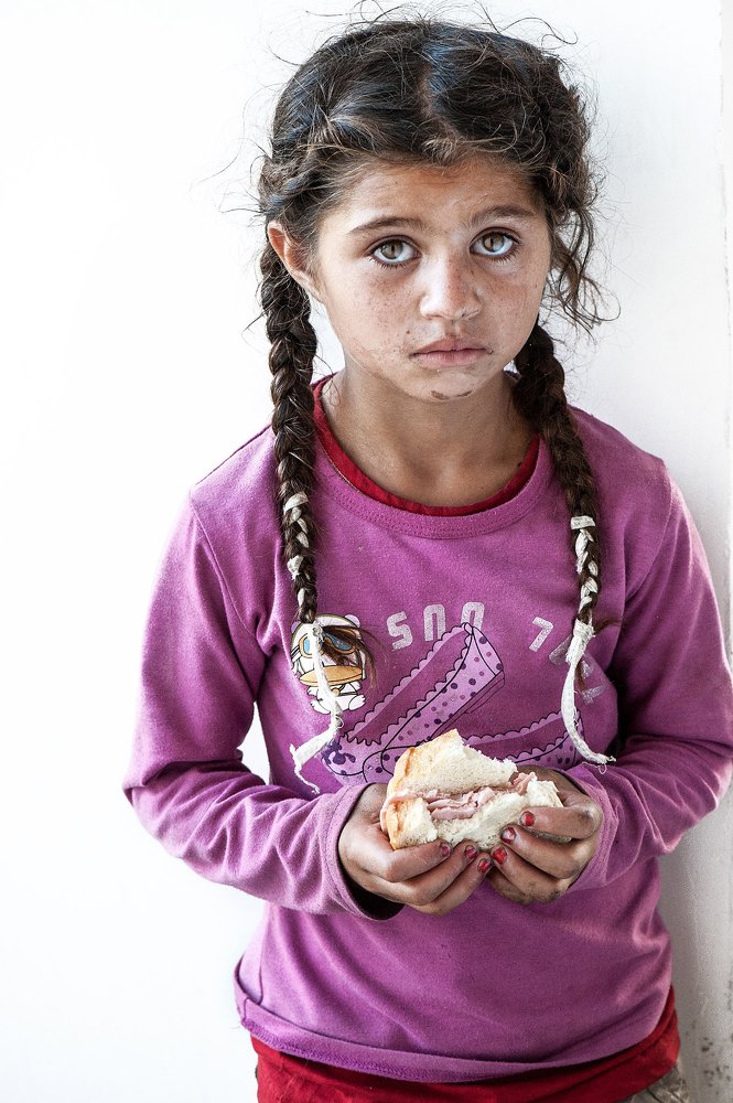 Bare eyes begging a controversial God for a piece of bread