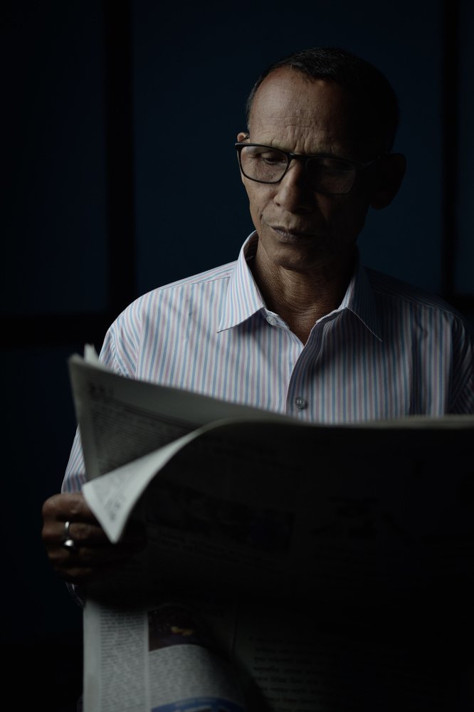 One key light studio portrait.