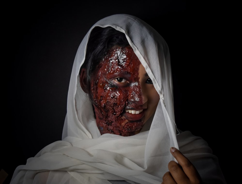 You can destroy her face with acid but not her smile