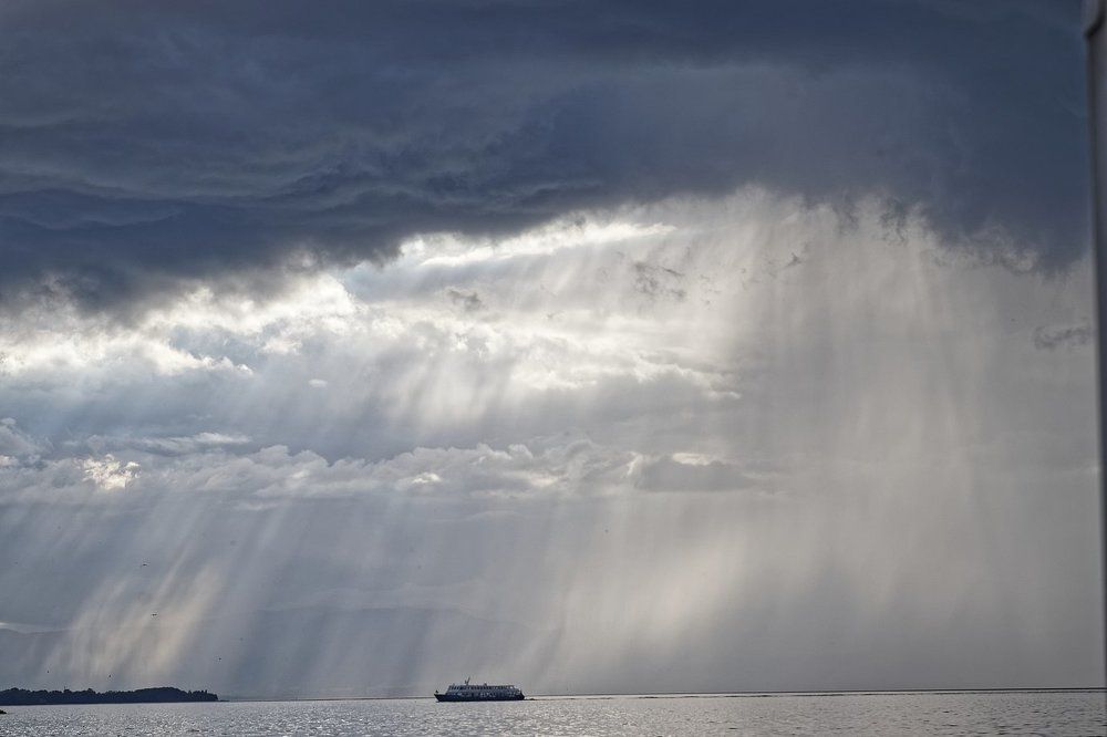 crossing Leman lake under rain and clouds