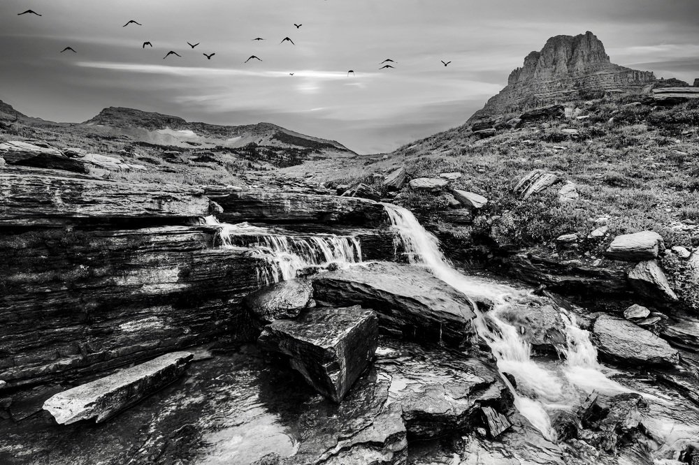 The river flows down the mountain side