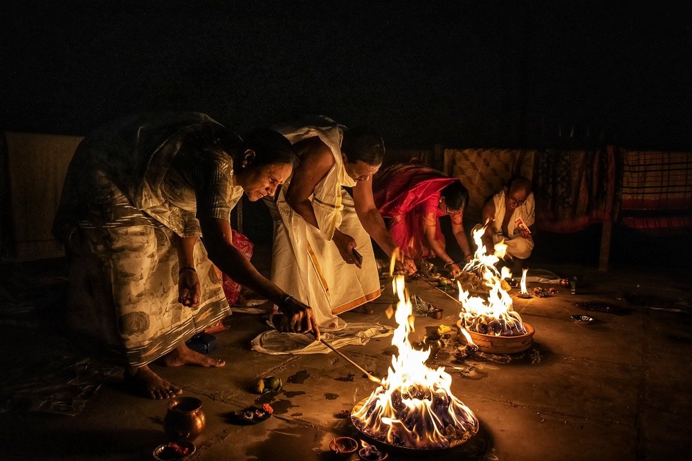 Family performing rituals on the ghats if Varanasi, India