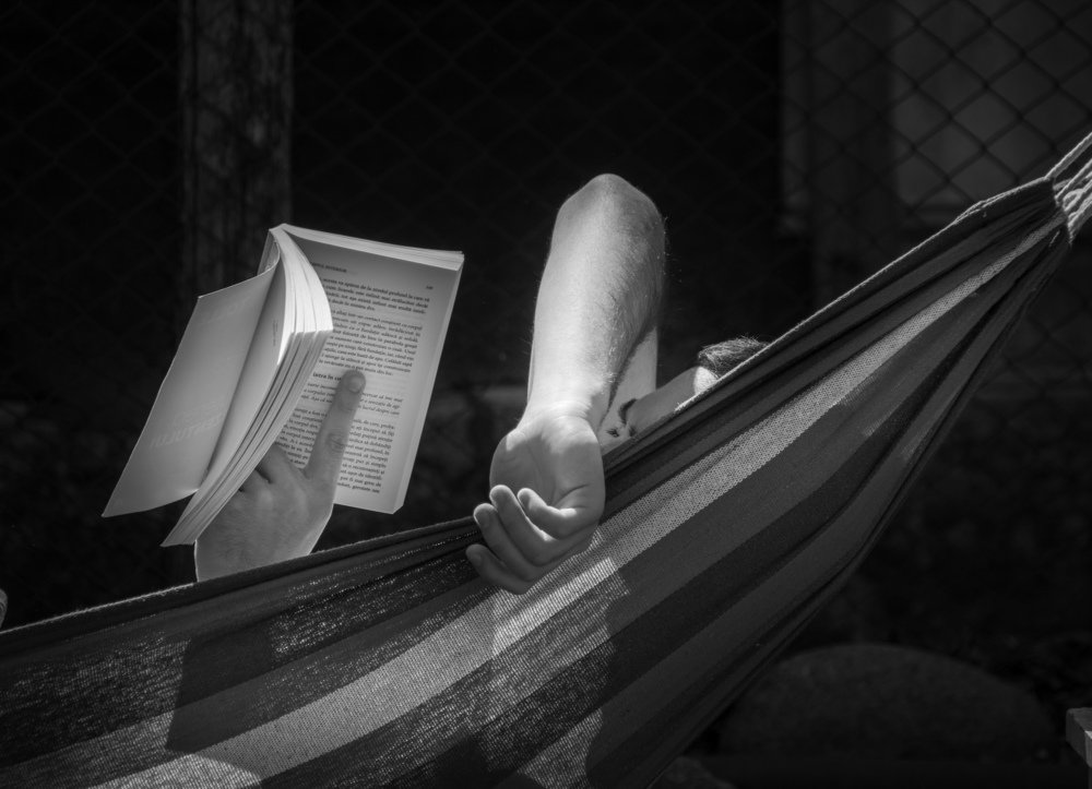 Teenager reads about a happy life on this earth