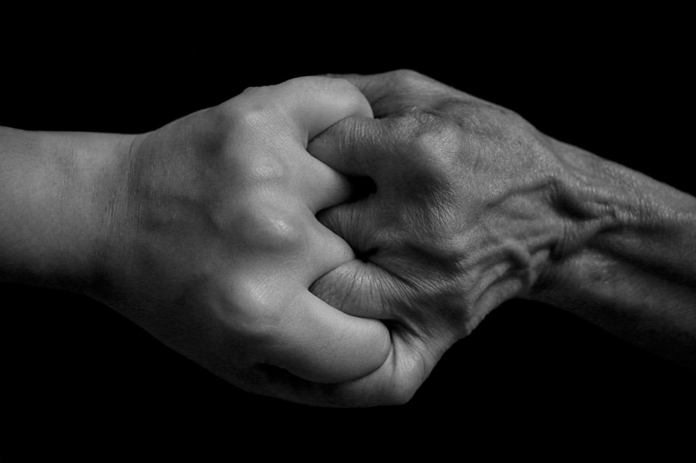 young and old hand energy