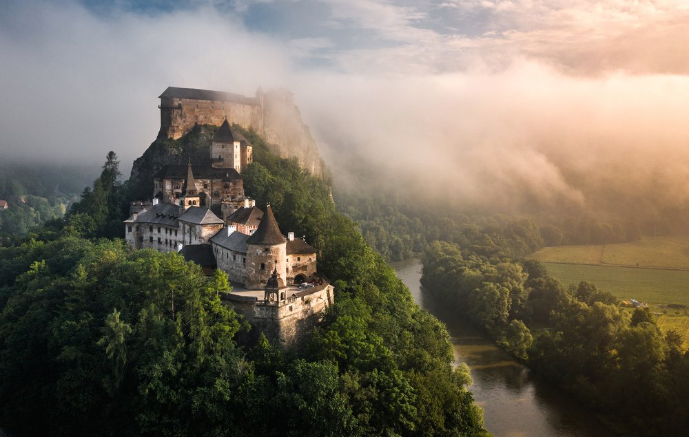 Orava Castle during foggy sunrise