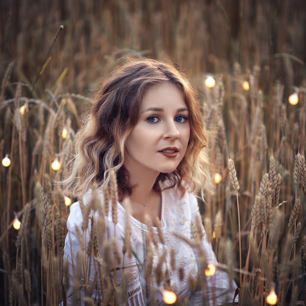 Girl in the field with lights