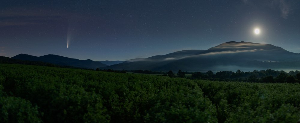 Comet C/2020 F3 Neowise and Moon above misty hills of  Poloniny national park Slovakia