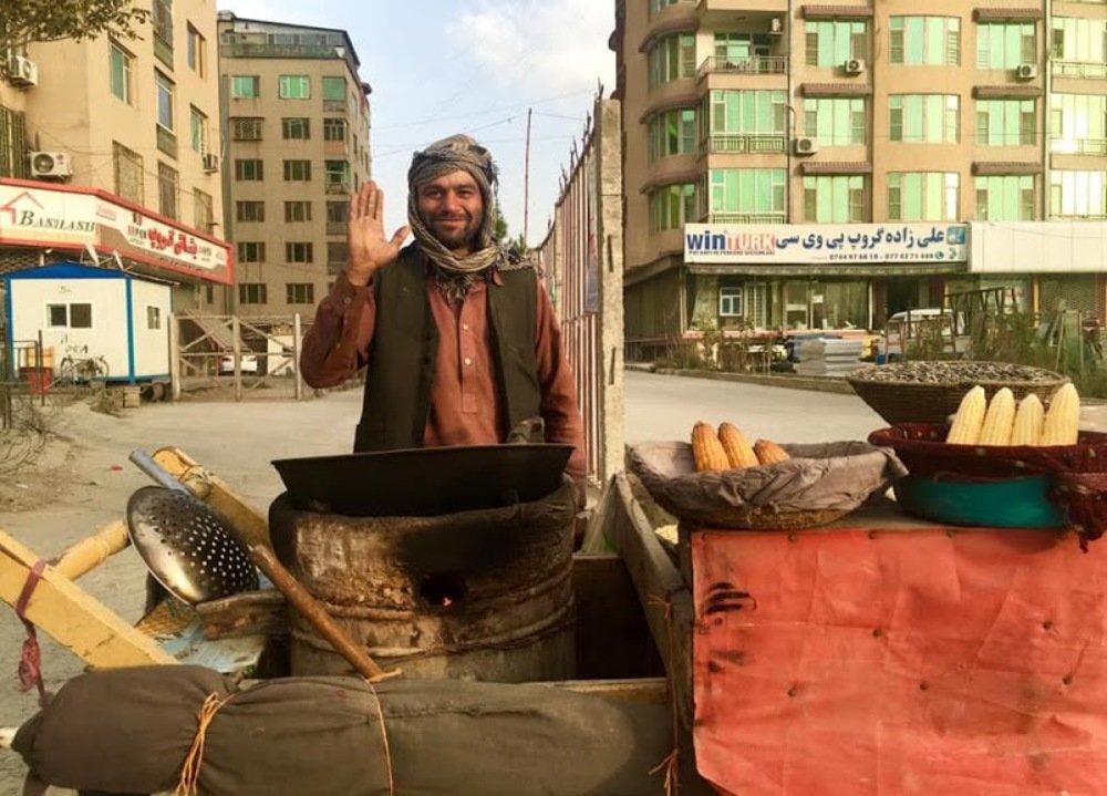 He sell corn with kind smile, love and peace