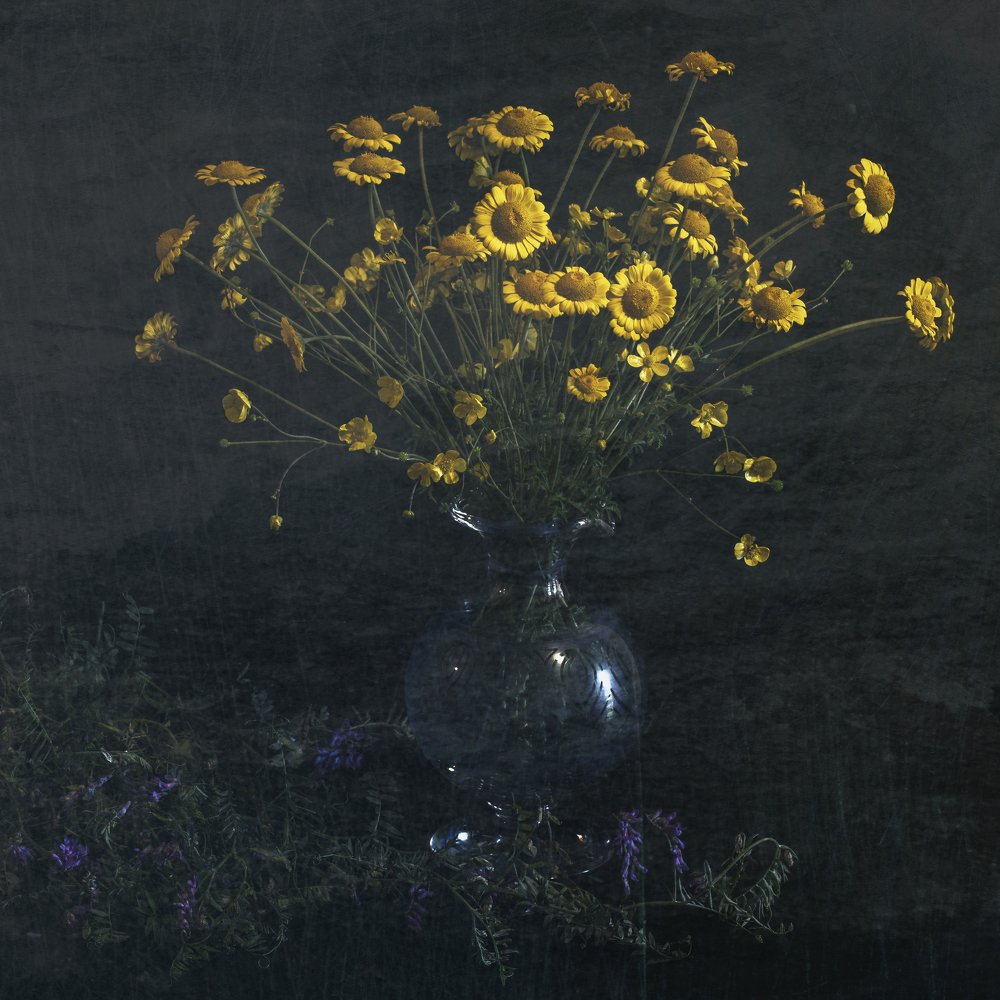 Yellow flower in a blue vase