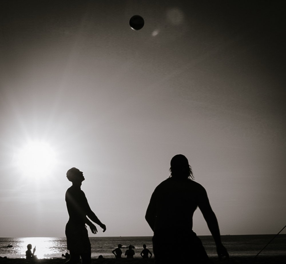 Playing volleyball at sunset. Thailand, Kamala Beach.