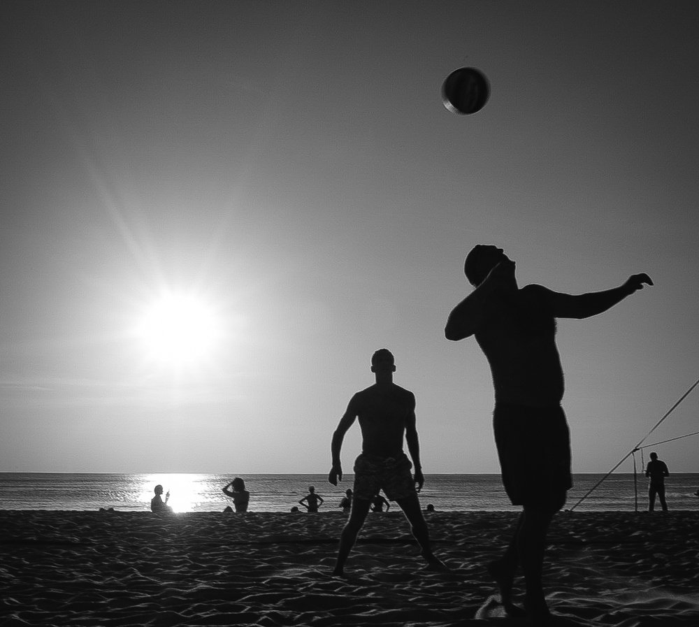 Playing volleyball at sunset. Thailand, Kamala Beach.
