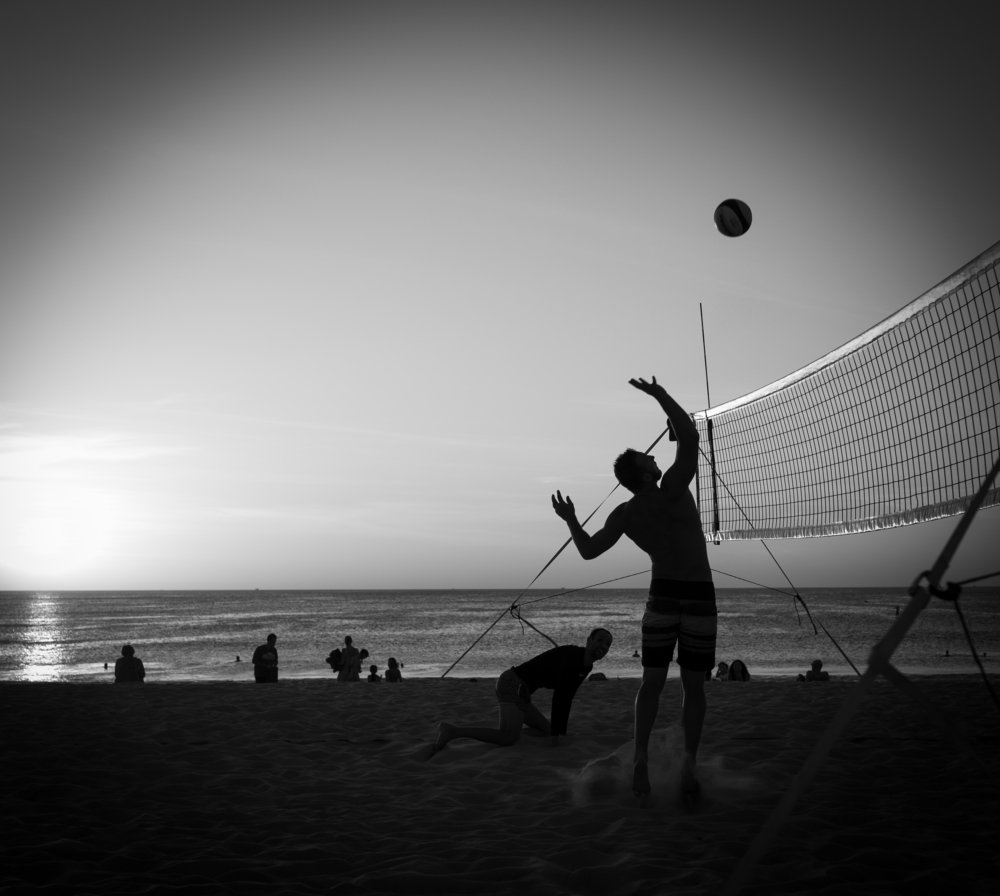Playing volleyball at sunset. Thailand, Kamala Beach.