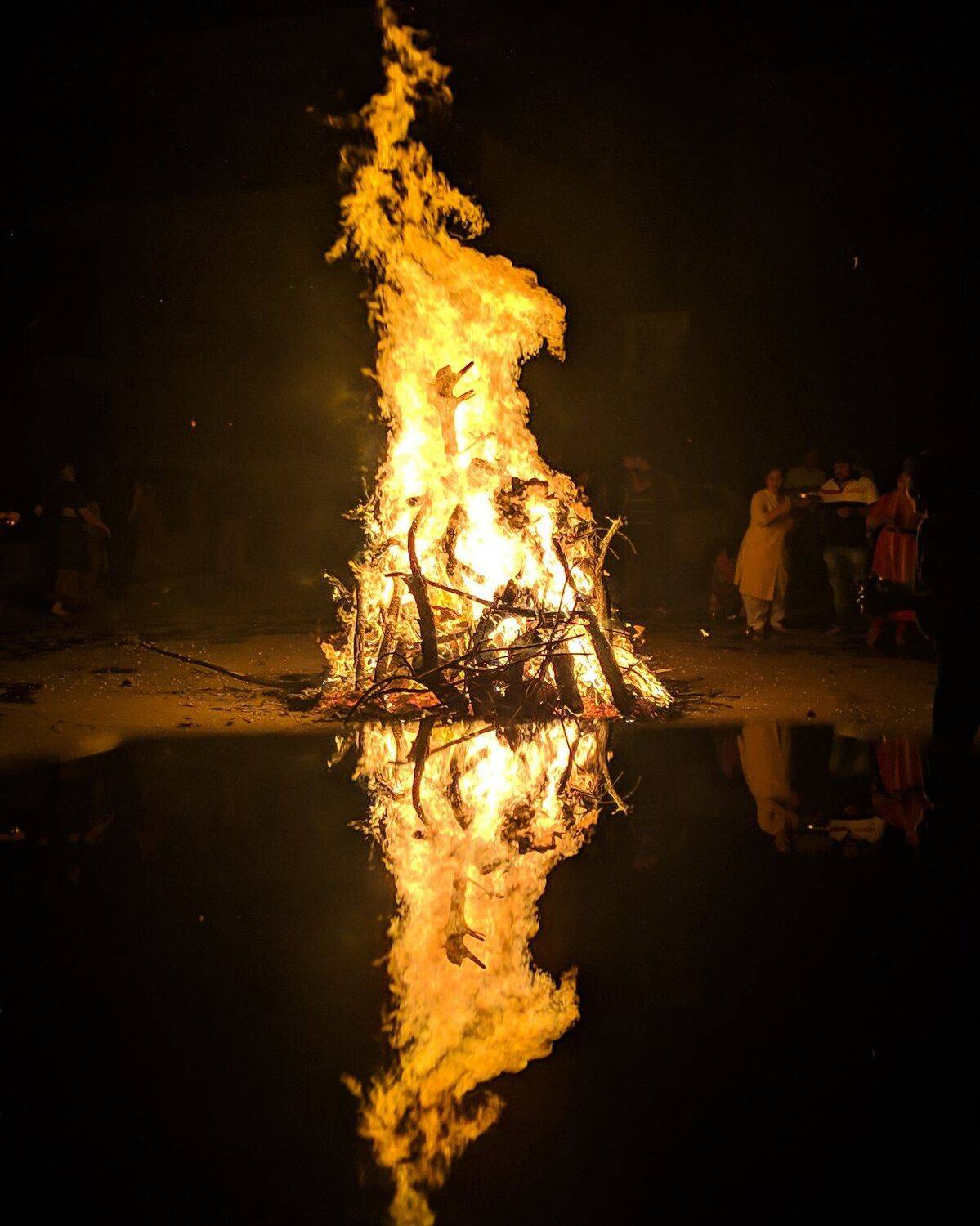Holi fire reflection