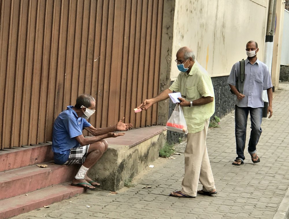 Beggar on the street with corona