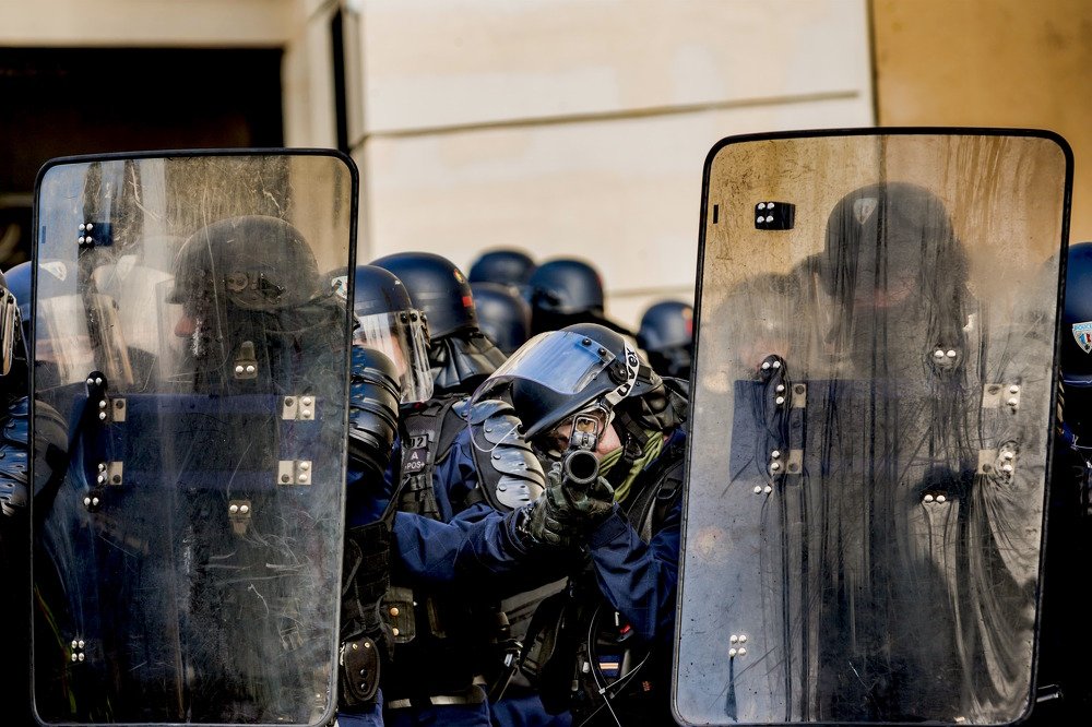 Riot police in yellow vests demonstrations in Paris.