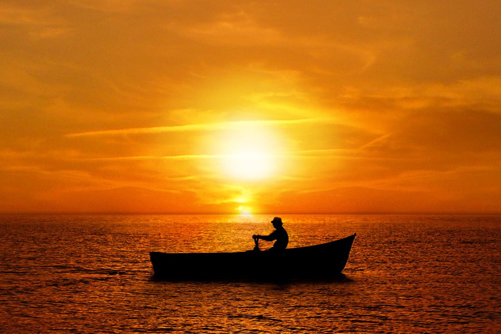 Rowing a boat at Sunset