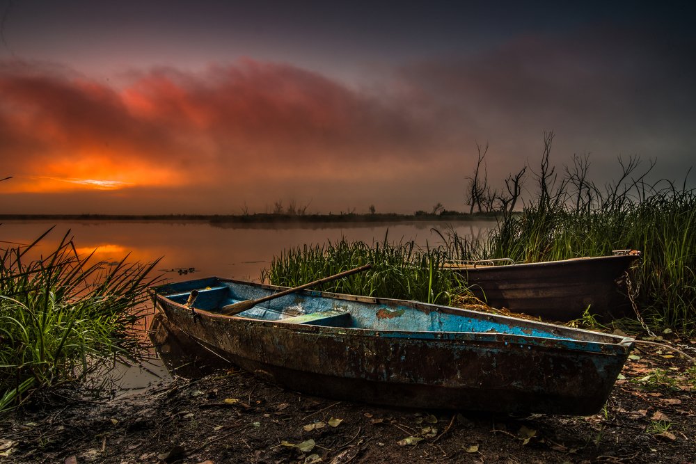Boats on river bank