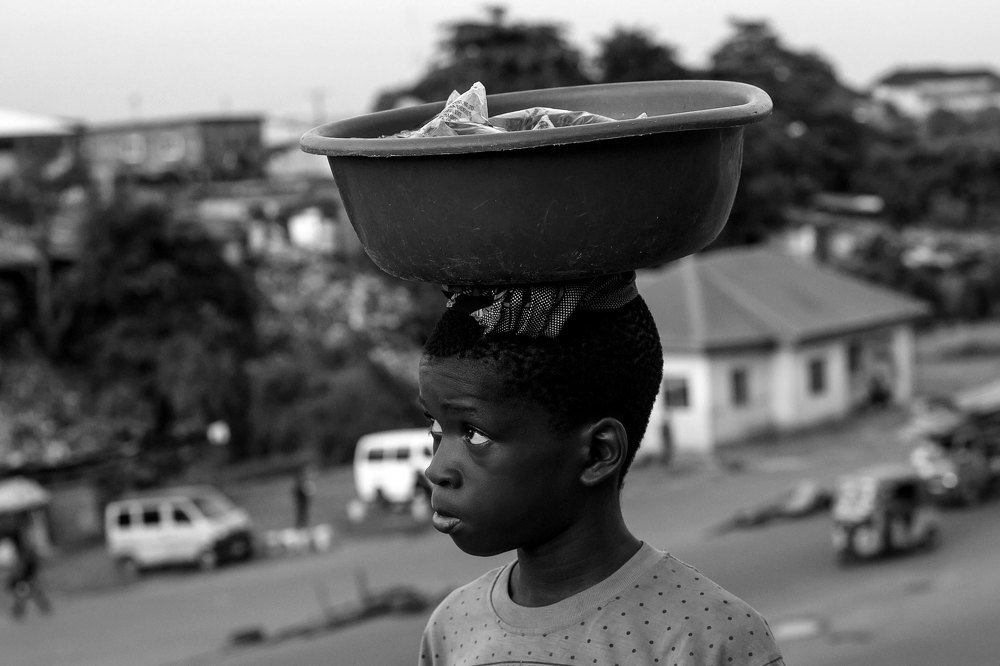 A boy selling sachet water