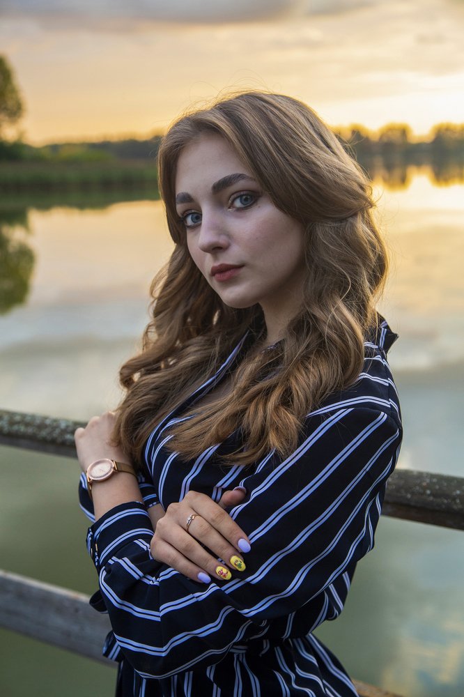 На закате.