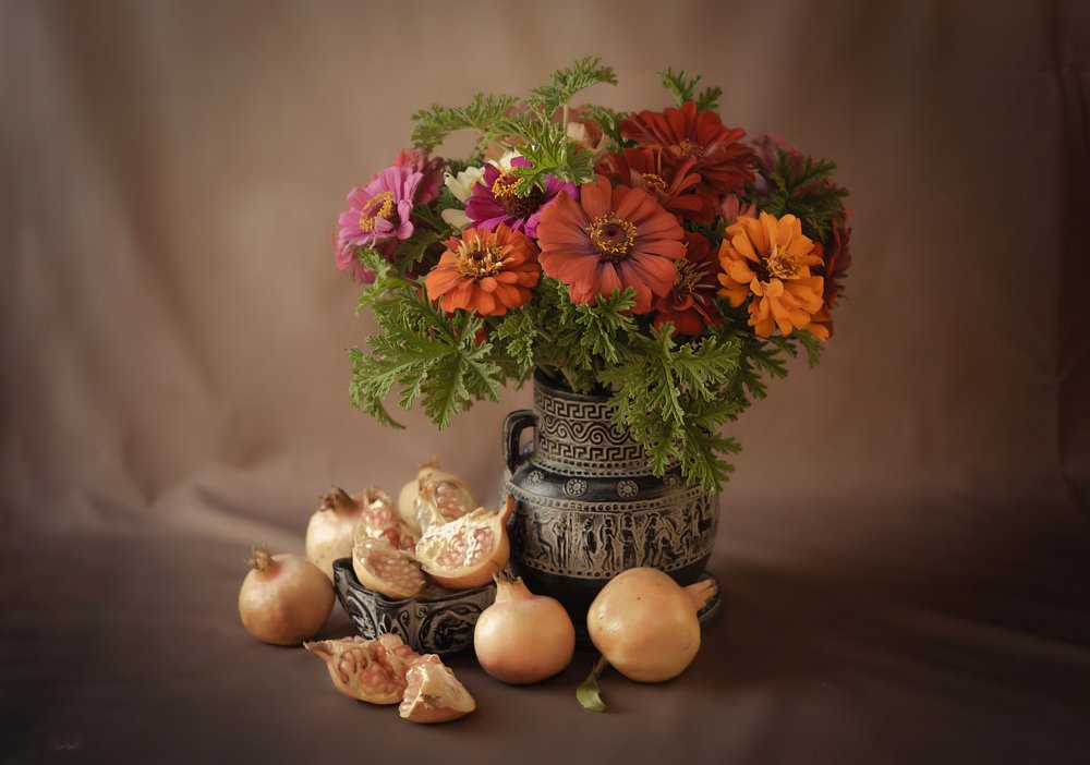 Flowers with pomegranate.