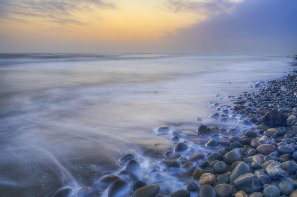 Stormy sunrise on the coast of the Caspian Sea