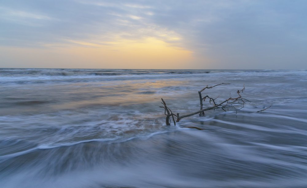 Stormy sunrise on the coast of the Caspian Sea
