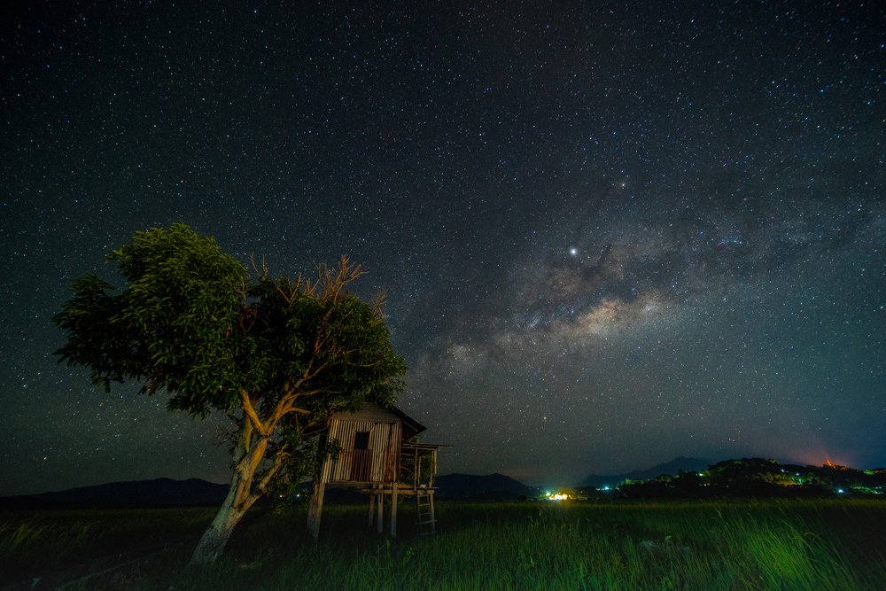 Night sky over paddy hut