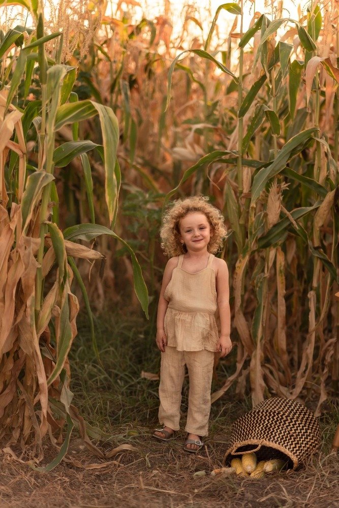 Sisters in the corn and watermelon field